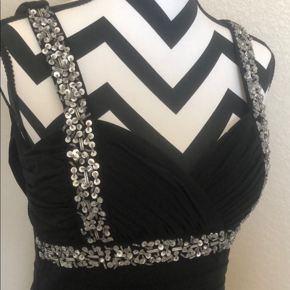 Black dress with beaded accents.